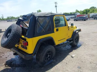 2005 Jeep Wrangler Sport z VIN 1J4FA49S65P381798, wystawiony jako IAAI lot #42305109 z przebiegiem 71 880 mil mil oraz . Historia ofert i sprzedaży dostępna na DreamBid. Obrazek 4.