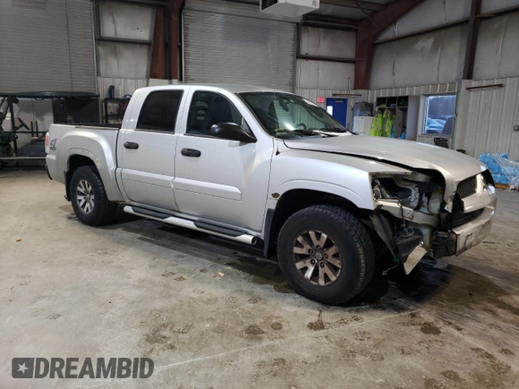 2007 Mitsubishi Raider LS z VIN 1Z7HT28KX7S216386, wystawiony jako Copart lot #88034315 z przebiegiem 162 337 mil mil oraz Czysty tytuł • Clean title. Historia ofert i sprzedaży dostępna na DreamBid. Obrazek 4.