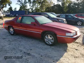 1998 Cadillac Eldorado z VIN 1G6EL12Y4WU610896, wystawiony jako Copart lot #74662244 z przebiegiem Nie podano mil oraz Szkody całkowita. Historia ofert i sprzedaży dostępna na DreamBid. Obrazek 4.