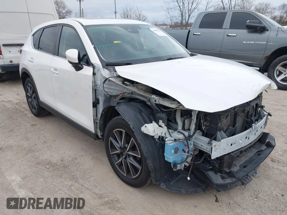 2018 Mazda CX-5 Touring z VIN JM3KFBCM6J0323107, wystawiony jako IAAI lot #41895519 z przebiegiem 86 124 mil mil oraz . Historia ofert i sprzedaży dostępna na DreamBid. Obrazek 1.