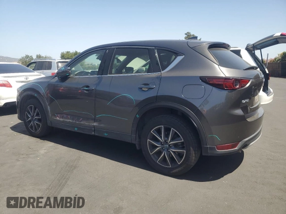 2018 Mazda CX-5 Grand Touring with VIN JM3KFADM3J1389911, listed as a Copart auction lot 60530295 with 103,177 mi miles and Salvage title. Bid and sale history available at DreamBid. Image 2.