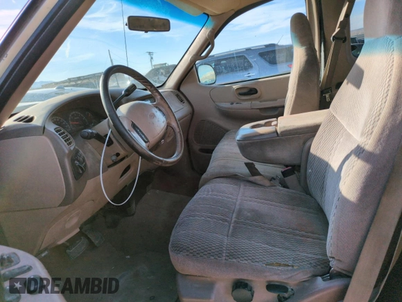 1999 Ford F-150 XL with VIN 1FTRX18L2XKA01348, listed as a Copart auction lot 50087595 with 202,021 mi miles and Salvage Title. Bid and sale history available at carsss.com. Image 7.