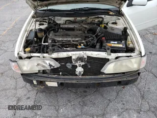 2002 Infiniti G20 Luxury z VIN JNKCP11AX2T500141, wystawiony jako Copart lot #70648434 z przebiegiem 196 559 mil mil oraz Szkody całkowita. Historia ofert i sprzedaży dostępna na DreamBid. Obrazek 13.