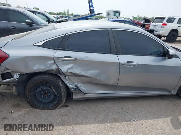 2019 Honda Civic LX with VIN 19XFC2F66KE026931, listed as a IAAI auction lot 41885137 with 55,057 mi miles and . Bid and sale history available at DreamBid. Image 13.