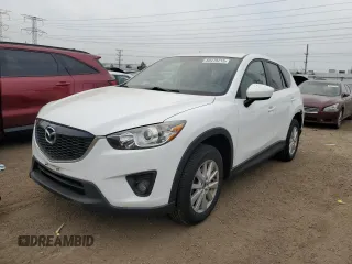 2014 Mazda CX-5 Touring with VIN JM3KE2CY2E0359887, listed as a Copart auction lot 60478215 with 134,091 mi miles and Salvage title. Bid and sale history available at DreamBid. Image 1.