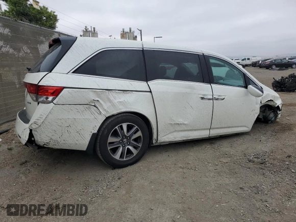 2014 Honda Odyssey Touring z VIN 5FNRL5H91EB089813, wystawiony jako Copart lot #58674275 z przebiegiem Nie podano mil oraz Szkoda całkowita • Salvage title. Historia ofert i sprzedaży dostępna na DreamBid. Obrazek 3.