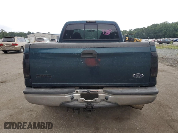 1999 Ford F-250 XL with VIN 1FTNX20FXXEA40858, listed as a Copart auction lot 63296925 with 368,565 mi miles and Salvage title. Bid and sale history available at DreamBid. Image 6.