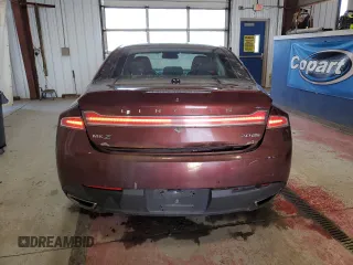 2015 Lincoln MKZ z VIN 3LN6L2J96FR600052, wystawiony jako Copart lot #56194715 z przebiegiem 259 911 mil mil oraz Szkoda całkowita • Salvage title. Historia ofert i sprzedaży dostępna na DreamBid. Obrazek 6.