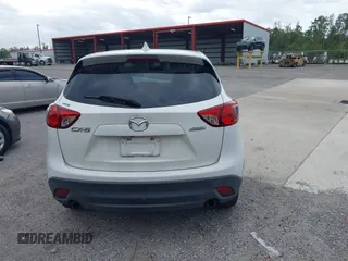 2015 Mazda CX-5 Touring with VIN JM3KE2CY8F0545967, listed as a IAAI auction lot 41909920 with 101,781 mi miles. Bid and sale history available at carsss.com. Image 16.