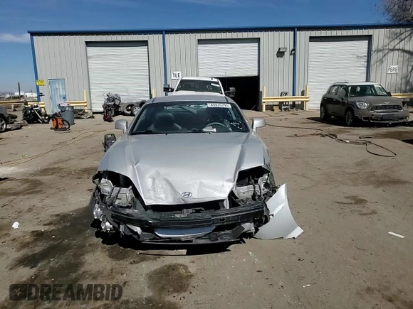 2006 Hyundai Tiburon GT z VIN KMHHN65F76U190851, wystawiony jako Copart lot #45935795 z przebiegiem 102 335 mil mil oraz Szkoda całkowita • Salvage title. Historia ofert i sprzedaży dostępna na DreamBid. Obrazek 11.