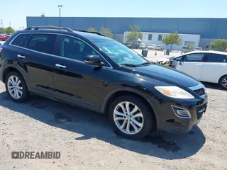 2011 Mazda CX-9 Grand Touring z VIN JM3TB2DV1B0300682, wystawiony jako IAAI lot #42702969 z przebiegiem 195 068 mil mil oraz . Historia ofert i sprzedaży dostępna na DreamBid. Obrazek 1.