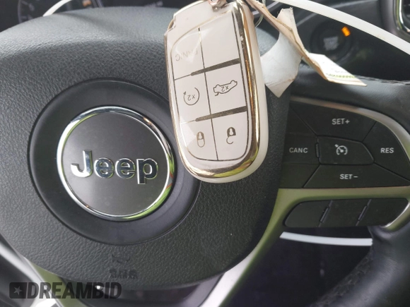2018 Jeep Grand Cherokee Laredo E with VIN 1C4RJFAG1JC499457, listed as a IAAI auction lot 41379459 with 127,344 mi miles and . Bid and sale history available at DreamBid. Image 11.