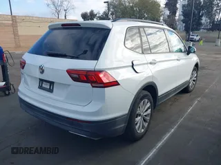 2019 Volkswagen Tiguan S with VIN 3VV1B7AX2KM039970, listed as a IAAI auction lot 41498706 with 56,907 mi miles and . Bid and sale history available at DreamBid. Image 4.