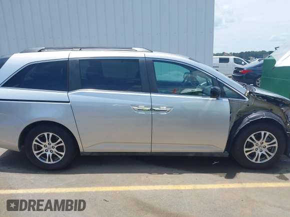 2012 Honda Odyssey EX-L with VIN 5FNRL5H65CB076534, listed as a IAAI auction lot 42440258 with 150,866 mi miles and . Bid and sale history available at DreamBid. Image 14.