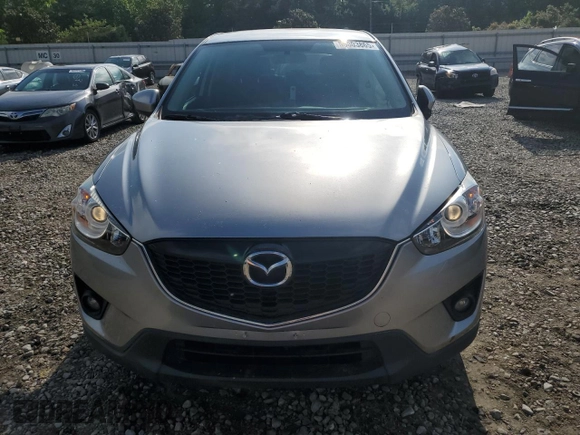 2014 Mazda CX-5 Touring z VIN JM3KE2CY0E0412733, wystawiony jako Copart lot #55803865 z przebiegiem 161 539 mil mil oraz Szkoda całkowita • Salvage title. Historia ofert i sprzedaży dostępna na DreamBid. Obrazek 5.