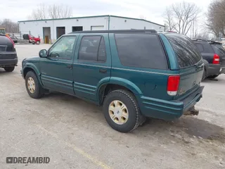1997 Oldsmobile Bravada with VIN 1GHDT13W2V2706505, listed as a IAAI auction lot 41835475 with 131,247 mi miles. Bid and sale history available at carsss.com. Image 3.