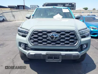 2023 Toyota Tacoma SR with VIN 3TMCZ5AN3PM590101, listed as a IAAI auction lot 42338670 with 12,970 mi miles and . Bid and sale history available at DreamBid. Image 12.
