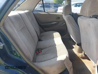 1999 Mazda Protege DX z VIN JM1BJ2229X0189290, wystawiony jako IAAI lot #41796448 z przebiegiem 281 528 mil mil oraz . Historia ofert i sprzedaży dostępna na DreamBid. Obrazek 8.
