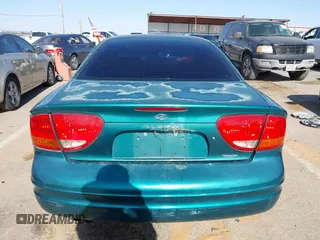 1999 Oldsmobile Alero GL z VIN 1G3NL52T0XC354966, wystawiony jako IAAI lot #42259258 z przebiegiem Nie podano mil oraz . Historia ofert i sprzedaży dostępna na DreamBid. Obrazek 16.