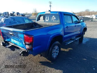 2018 Toyota Tacoma SR with VIN 3TMCZ5AN3JM138480, listed as a IAAI auction lot 41080910 with 99,225 mi miles. Bid and sale history available at carsss.com. Image 4.