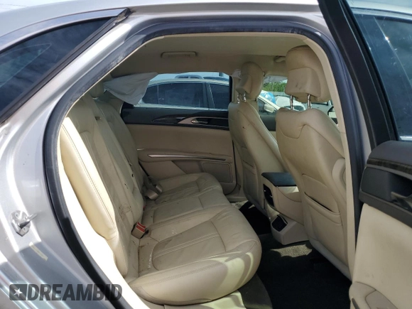 2014 Lincoln MKZ z VIN 3LN6L2G91ER831043, wystawiony jako Copart lot #63109715 z przebiegiem Nie podano mil oraz Szkoda całkowita • Salvage title. Historia ofert i sprzedaży dostępna na DreamBid. Obrazek 10.