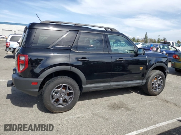 2023 Ford Bronco Sport Badlands z VIN 3FMCR9D97PRD35830, wystawiony jako Copart lot #56950865 z przebiegiem 7 401 mil mil oraz Szkoda całkowita • Salvage title. Historia ofert i sprzedaży dostępna na DreamBid. Obrazek 3.