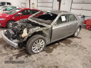 2013 Chrysler 300 with VIN 2C3CCAKT9DH581098, listed as a IAAI auction lot 41411138 with 104,732 mi miles. Bid and sale history available at carsss.com. Image 2.