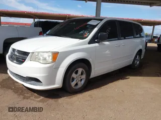 2012 Dodge Grand Caravan SE with VIN 2C4RDGBGXCR407641, listed as a IAAI auction lot 41950812 with 151,331 mi miles and . Bid and sale history available at DreamBid. Image 2.
