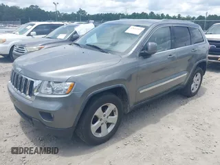 2011 Jeep Grand Cherokee Laredo with VIN 1J4RR4GG3BC595896, listed as a IAAI auction lot 42632333 with 135,426 mi miles and . Bid and sale history available at DreamBid. Image 2.