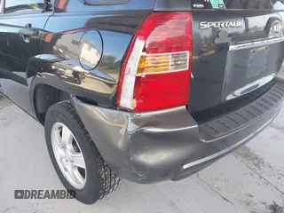 2007 Kia Sportage LX with VIN KNDJF724877450962, listed as a IAAI auction lot 41918290 with 216,476 mi miles and . Bid and sale history available at carsss.com. Image 6.