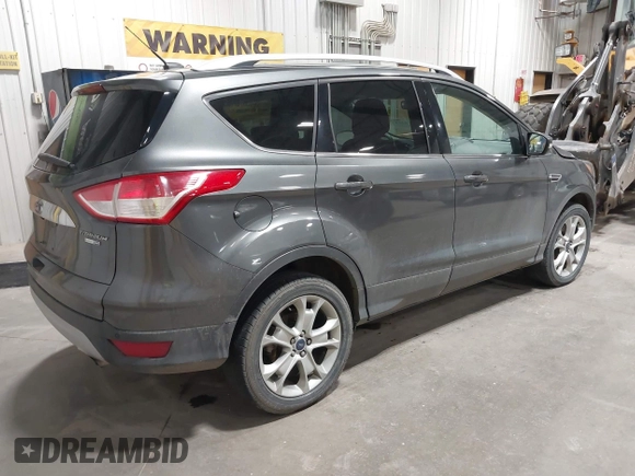 2016 Ford Escape Titanium with VIN 1FMCU9J93GUC39933, listed as a IAAI auction lot 42616323 with 116,482 mi miles and . Bid and sale history available at DreamBid. Image 4.