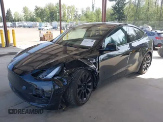 2022 Tesla Model Y Long Range with VIN 7SAYGDEE1NF550202, listed as a IAAI auction lot 42121718 with 28,211 mi miles and . Bid and sale history available at carsss.com. Image 2.