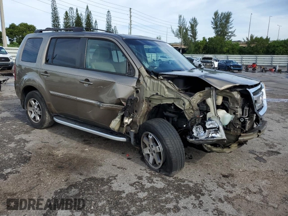 2010 Honda Pilot Touring with VIN 5FNYF3H81AB016255, listed as a Copart auction lot 71052644 with 96,847 mi miles and Salvage Title. Bid and sale history available at DreamBid. Image 4.