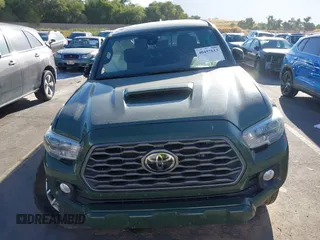 2021 Toyota Tacoma SR with VIN 3TYCZ5AN2MT039450, listed as a IAAI auction lot 40457613 with 54,176 mi miles and . Bid and sale history available at DreamBid. Image 12.