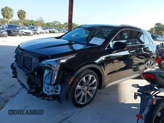 2020 Cadillac XT4 FWD Premium Luxury with VIN 1GYFZCR42LF144359, listed as a IAAI auction lot 42012677 with 34,490 mi miles and . Bid and sale history available at carsss.com. Image 2.