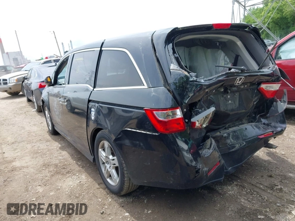 2012 Honda Odyssey Touring with VIN 5FNRL5H91CB121950, listed as a IAAI auction lot 42456620 with 200,831 mi miles and . Bid and sale history available at DreamBid. Image 3.
