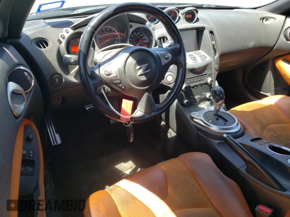 2014 Nissan 370Z Nismo with VIN JN1AZ4EH7EM633324, listed as a Copart auction lot 53812335 with 57,856 mi miles and Salvage Title. Bid and sale history available at DreamBid. Image 8.