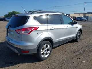 2013 Ford Escape SE with VIN 1FMCU9GX5DUD34978, listed as a IAAI auction lot 42570946 with 133,408 mi miles and . Bid and sale history available at DreamBid. Image 4.