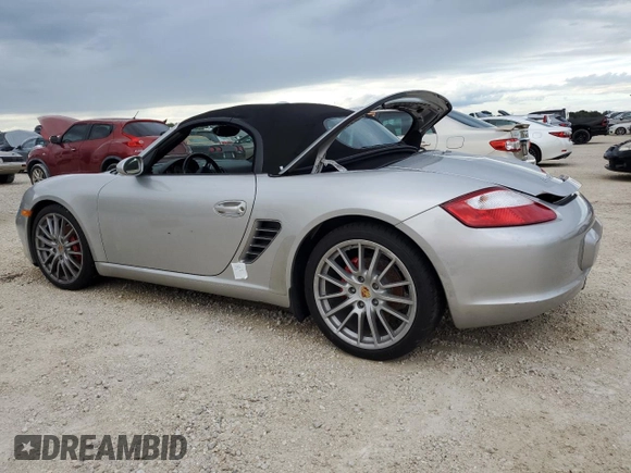 2007 Porsche Boxster S z VIN WP0CB29857U730730, wystawiony jako Copart lot #74175794 z przebiegiem Nie podano mil oraz Szkoda całkowita • Salvage title. Historia ofert i sprzedaży dostępna na DreamBid. Obrazek 2.