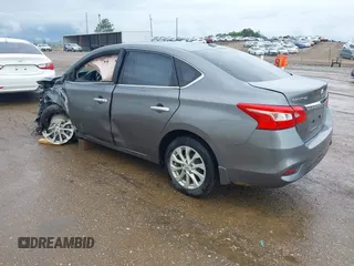 2019 Nissan Sentra S z VIN 3N1AB7AP7KY364754, wystawiony jako IAAI lot #42056332 z przebiegiem 170 068 mil mil oraz . Historia ofert i sprzedaży dostępna na DreamBid. Obrazek 3.