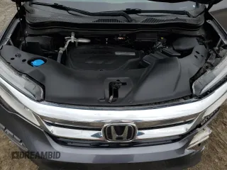 2020 Honda Pilot Touring 7-Passenger z VIN 5FNYF6H69LB005829, wystawiony jako Copart lot #52702555 z przebiegiem 90 746 mil mil oraz Szkoda całkowita • Salvage title. Historia ofert i sprzedaży dostępna na DreamBid. Obrazek 13.