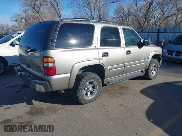 2002 Chevrolet Tahoe Z71 with VIN 1GNEK13Z32R125421, listed as a IAAI auction lot 41859011 with 216,021 mi miles. Bid and sale history available at carsss.com. Image 4.