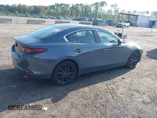 2024 Mazda 3 S Carbon Edition with VIN 3MZBPBCM6RM411828, listed as a IAAI auction lot 42802141 with 40,061 mi miles and . Bid and sale history available at DreamBid. Image 4.