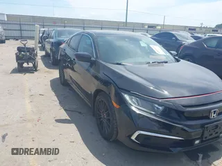 2020 Honda Civic LX with VIN 19XFC2F65LE003996, listed as a IAAI auction lot 42055870 with 66,119 mi miles and . Bid and sale history available at DreamBid. Image 1.