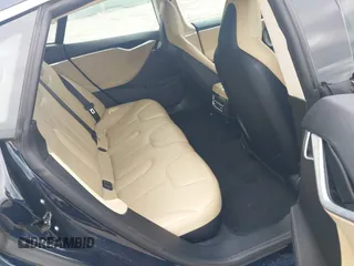 2014 Tesla Model S 60 z VIN 5YJSA1H17EFP33860, wystawiony jako IAAI lot #42471432 z przebiegiem 142 045 mil mil oraz . Historia ofert i sprzedaży dostępna na DreamBid. Obrazek 8.