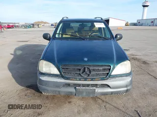 1998 Mercedes-Benz M-Class with VIN 4JGAB54E7WA034632, listed as a IAAI auction lot 41523291 with 153,241 mi miles. Bid and sale history available at carsss.com. Image 6.