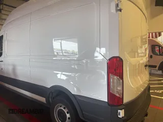 2023 Ford Transit Cargo with VIN 1FTBR1X86PKC09421, listed as a IAAI auction lot 42796097 with 10,233 mi miles and . Bid and sale history available at DreamBid. Image 27.