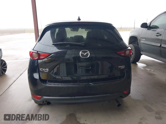 2021 Mazda CX-5 Signature with VIN JM3KFBEY5M0432033, listed as a IAAI auction lot 41607215 with 49,870 mi miles. Bid and sale history available at carsss.com. Image 16.