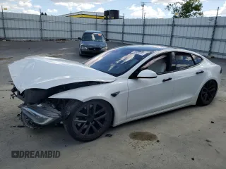 2022 Tesla Model S с VIN 5YJSA1E57NF474679, выставлен на аукционе Copart как лот 56608285 с пробегом Не указан миль и Списание • Salvage title. История ставок и продаж доступна на DreamBid. Изображение 1.