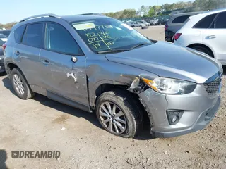2014 Mazda CX-5 Touring with VIN JM3KE4CY0E0302583, listed as a IAAI auction lot 41947735 with 122,077 mi miles. Bid and sale history available at carsss.com. Image 1.